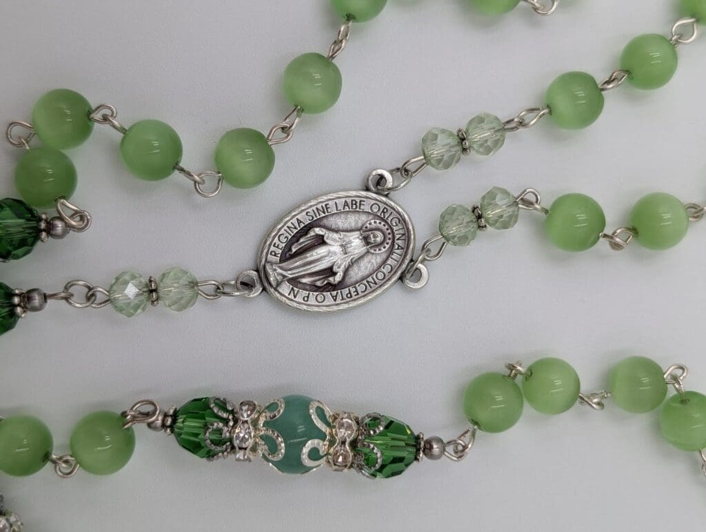 Green rosary representing the most beautiful rosary for prayer, reflection, and custom Catholic devotion